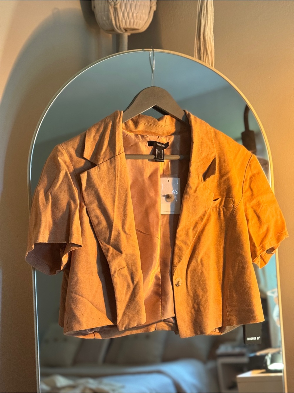 New with tags Forever 21 cropped short-sleeve blazer in a warm brown/tan shade.